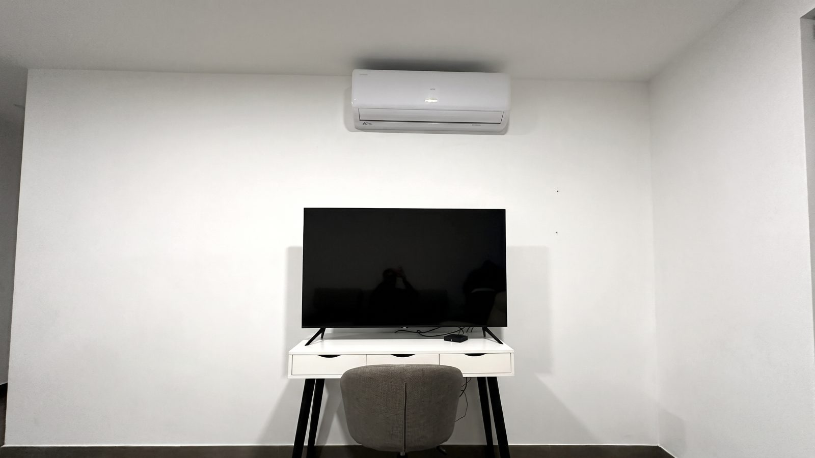 After: mini-split installed above the TV