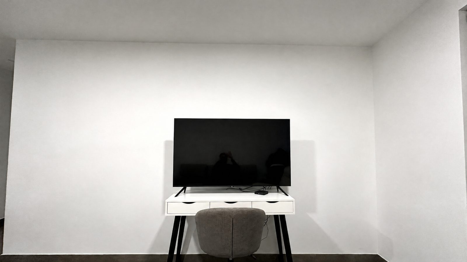 Before: empty wall above the TV